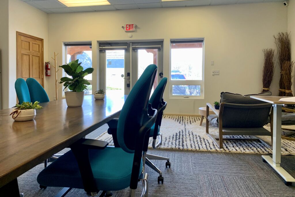 Shared Office Image of office shared space with table, chairs, and lounge area.